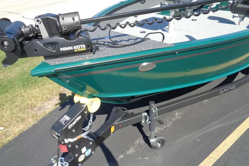 Slide: The Image of 2026 Lund 1800 Explorer Tiller boat with Minn Kota Ulterra motor on trailer. - 13