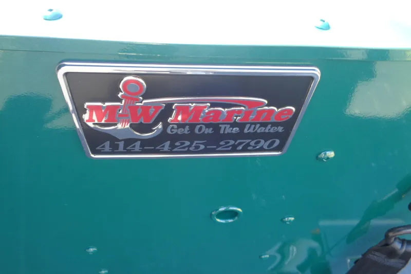 Slide: The Image of MW Marine logo on Lund 1800 Explorer Tiller, 2026 model, with contact number. - 19