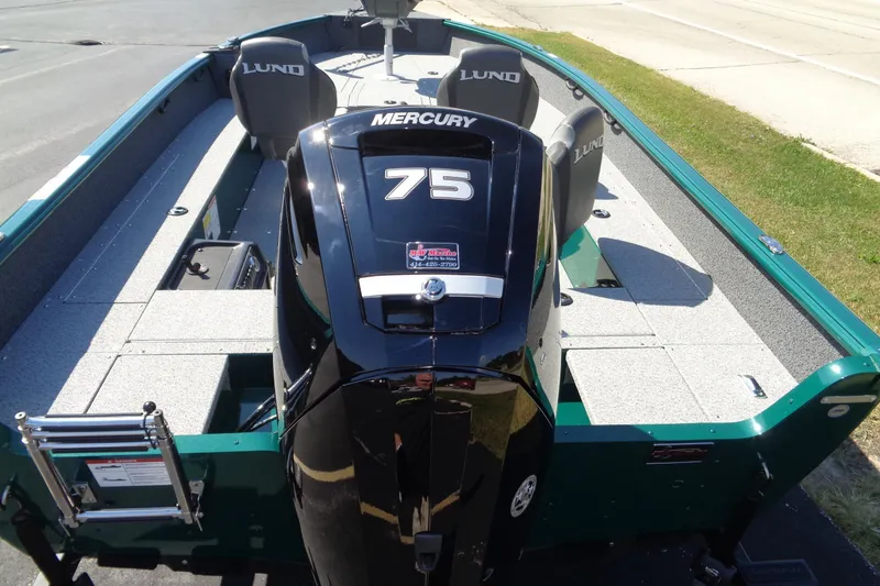 Slide: The Image of 2026 Lund 1800 Explorer Tiller boat with Mercury 75 engine, featuring spacious seating and deck. - 6