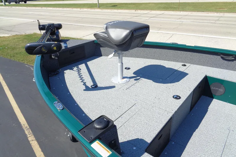 Slide: The Image of 2026 Lund 1800 Explorer Tiller boat deck with seat and trolling motor. - 8
