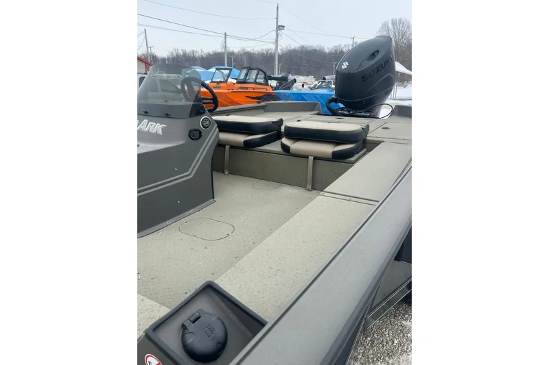 Slide: The Image of 2026 SeaArk Phantom 20XV boat with Suzuki outboard motor, gray interior, and seating. - 17