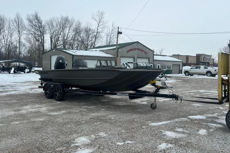 Slide: The Image of 2026 SeaArk Phantom 20XV boat on trailer in snowy outdoor setting. - 21
