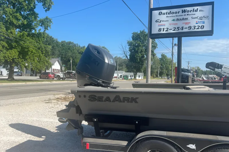 Slide: The Image of 2026 SeaArk V-Cat 200 SC boat interior with steering console and seating. - 5