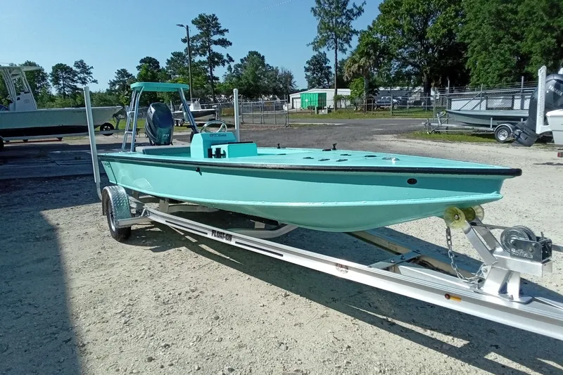 Slide: The Image of 2025 Cast & Blast 17CC Flats boat on trailer, parked outdoors. - 6