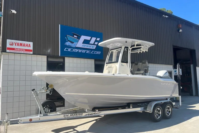 The Image of 2026 Key West 219 FS boat on trailer outside marine service center. - 0