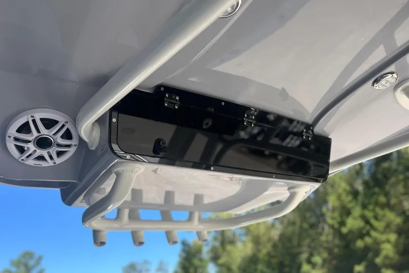 Slide: The Image of 2026 Key West 219 FS boat with speaker and storage compartment, viewed from below. - 18