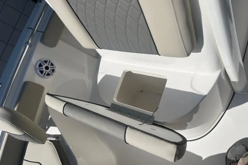 Slide: The Image of 2026 Key West 219 FS boat interior with seating and storage compartment. - 23