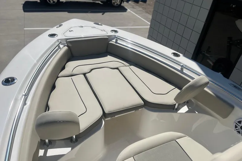 Slide: The Image of 2026 Key West 219 FS boat interior with cushioned seating and sleek design. - 24