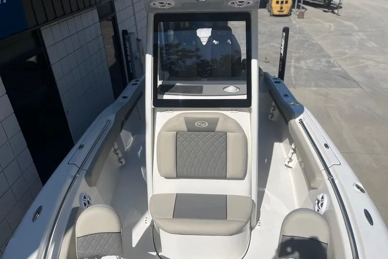 Slide: The Image of 2026 Key West 219 FS boat interior with cushioned seating and modern design. - 25