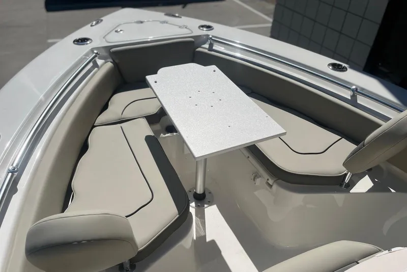 Slide: The Image of 2026 Key West 219 FS boat interior with cushioned seating and table. - 27