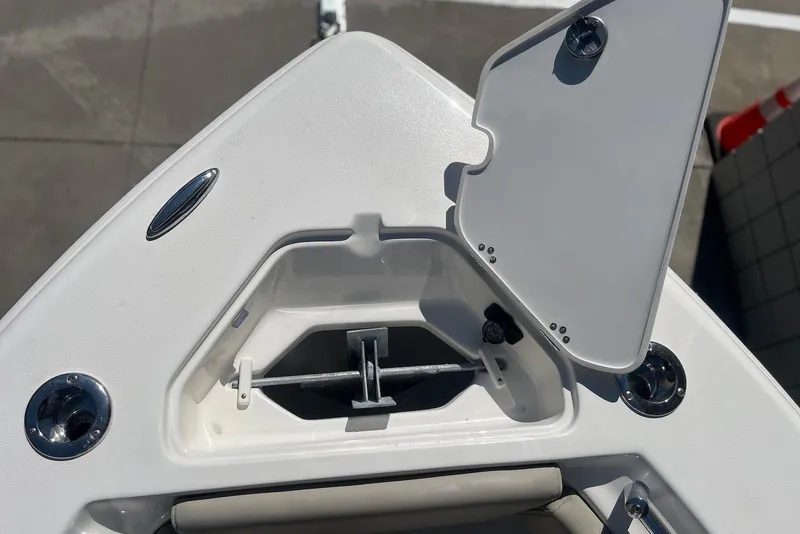 Slide: The Image of Open anchor compartment on 2026 Key West 219 FS boat, showcasing storage space. - 31
