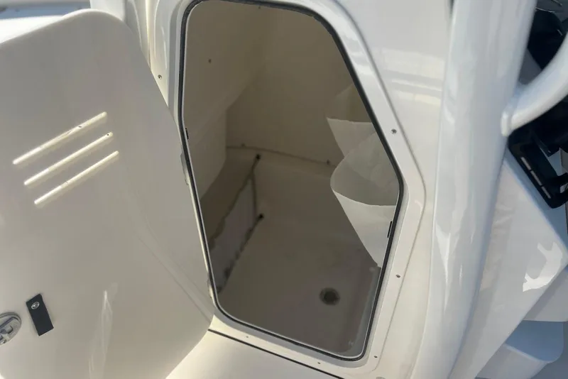 Slide: The Image of Open storage compartment on 2026 Key West 219 FS boat, showcasing interior space. - 32