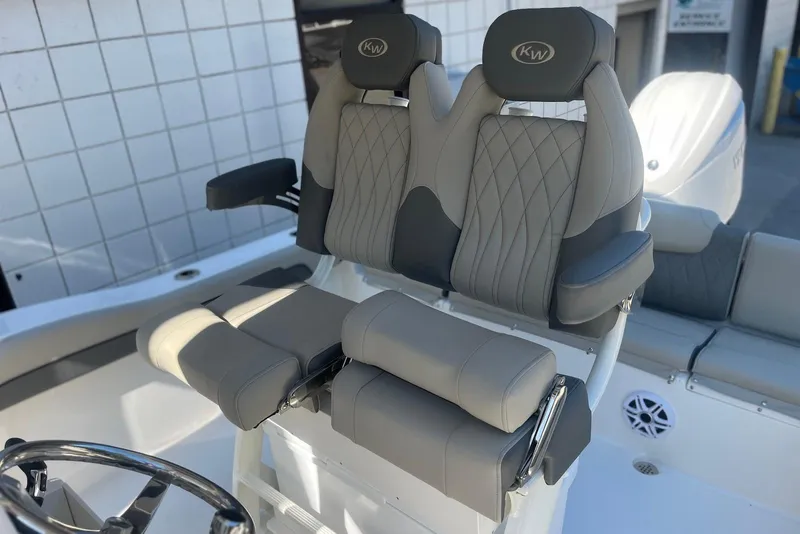 Slide: The Image of 2026 Key West 219 FS boat seats with elegant gray upholstery and armrests. - 6