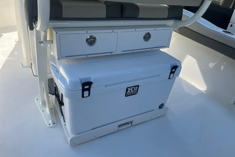Slide: The Image of 2026 Key West 219 FS boat interior with storage drawers and K2 cooler. - 8