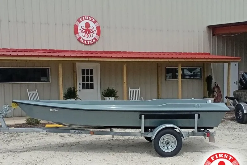 The Image of Fast Craft XR15 boat on trailer outside First Mates building, 2025 model. - 1