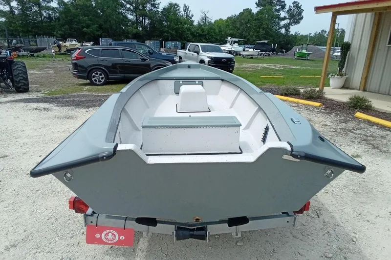 Slide: The Image of Fast Craft XR15 boat, 2025 model, on trailer in outdoor setting. - 10