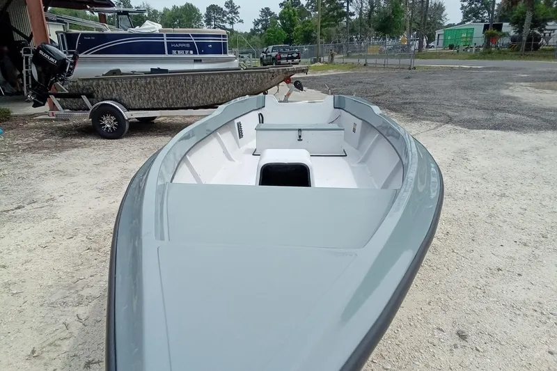 Slide: The Image of 2025 Fast Craft XR15 boat on trailer, parked outdoors. - 5