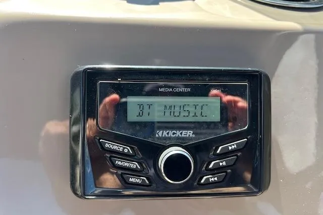 Slide: The Image of Kicker media center displaying "BT Music" on Sun Tracker Party Barge 22 DLX, 2023 model. - 5