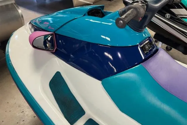 Slide: The Image of 1995 Yamaha WaveRunner Wave Venture, teal and purple jet ski, close-up view. - 10