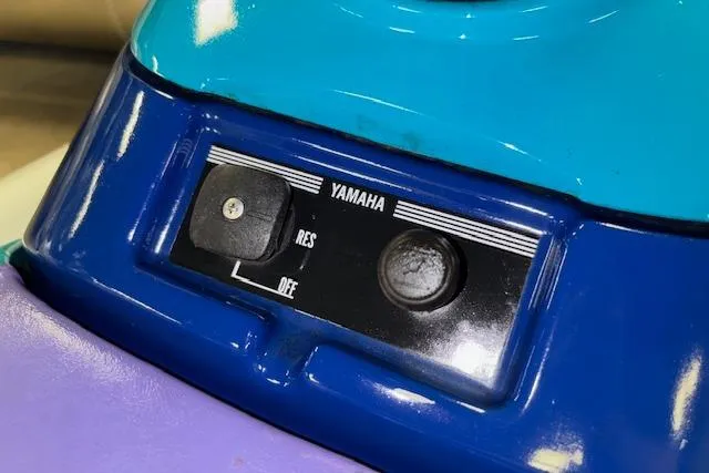 Slide: The Image of 1995 Yamaha WaveRunner Wave Venture control panel with blue and purple accents. - 7