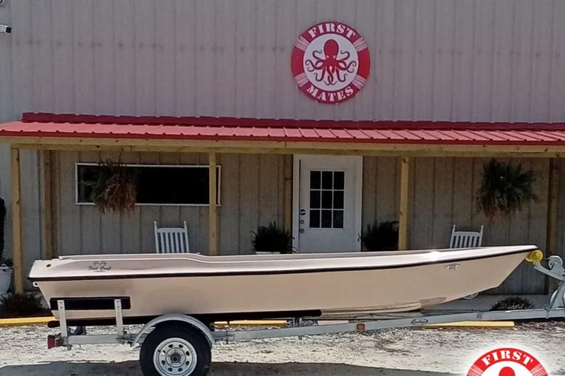 The Image of Fast Craft XR15 boat on trailer outside First Mates store, 2025 model. - 1