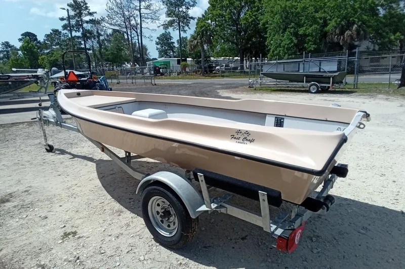 Slide: The Image of 2025 Fast Craft XR15 boat on trailer in outdoor setting. - 5