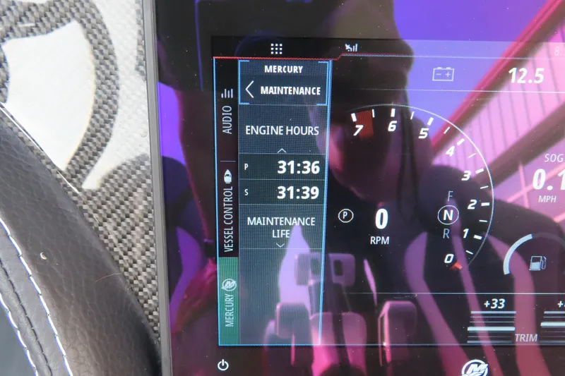 Slide: The Image of Close-up of 2024 MTI 440X dashboard display showing engine hours and maintenance details. - 12