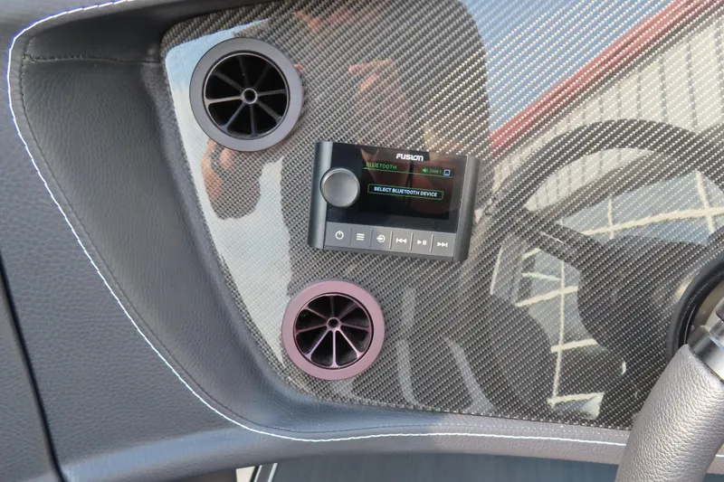 Slide: The Image of 2024 MTI 440X dashboard with carbon fiber finish and Fusion Bluetooth audio system. - 13