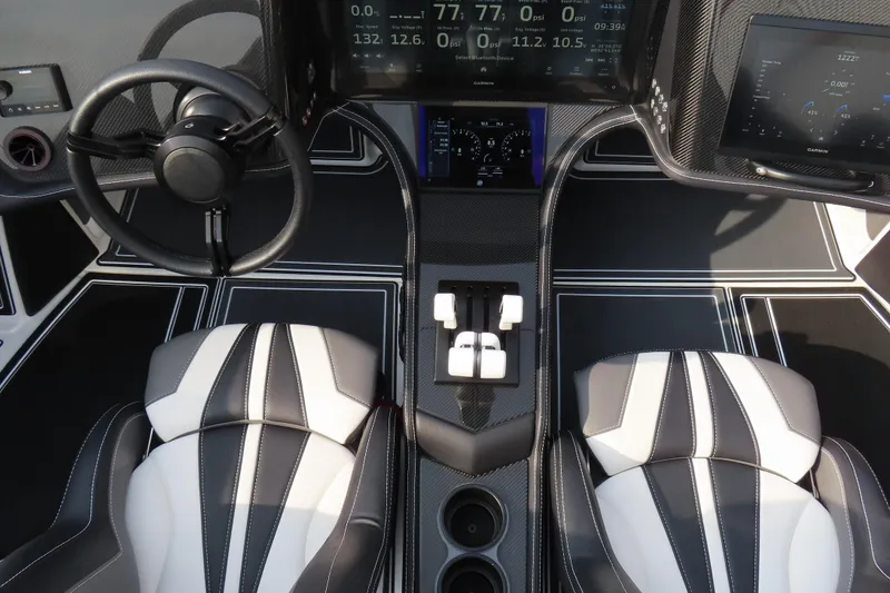 Slide: The Image of 2024 MTI 440X cockpit with modern steering, dual seats, and advanced digital displays. - 14