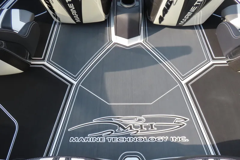 Slide: The Image of 2024 MTI 440X boat interior with Marine Technology Inc. logo and sleek design. - 17