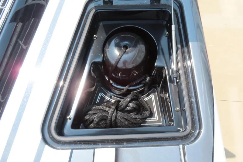 Slide: The Image of 2024 MTI 440X boat compartment with rope and fender storage. - 20