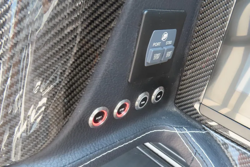 Slide: The Image of Control panel of 2024 MTI 440X with carbon fiber finish and start-stop buttons. - 22