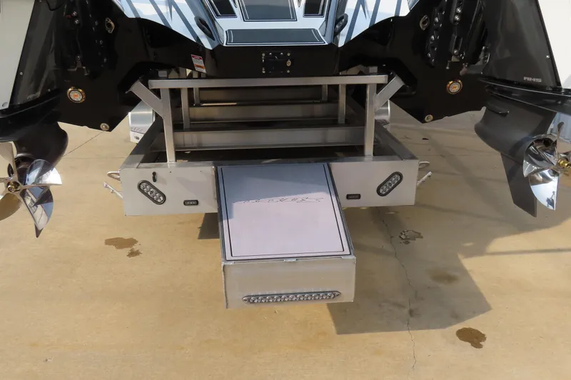 Slide: The Image of 2024 MTI 440X boat stern with dual propellers and swim platform. - 7