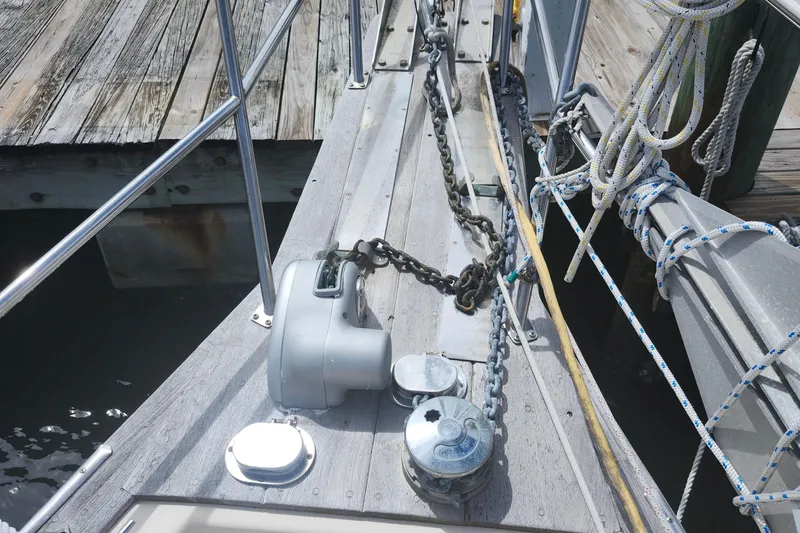 Slide: The Image of Bow of 1995 Island Packet 32 sailboat with anchor chain and ropes. - 11