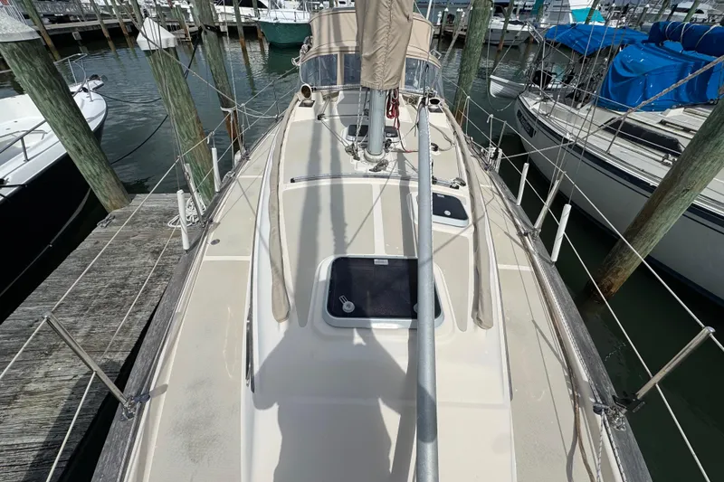Slide: The Image of 1995 Island Packet 32 sailboat docked at marina, view of deck and mast. - 15