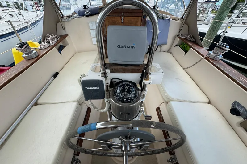 Slide: The Image of Cockpit of 1995 Island Packet 32 sailboat with Garmin and Raymarine equipment. - 19