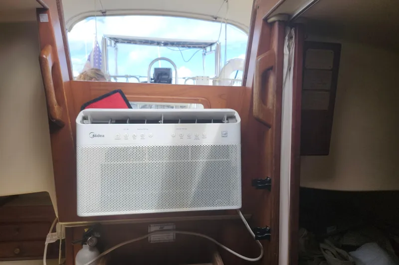 Slide: The Image of Air conditioner installed inside a 1995 Island Packet 32 sailboat cabin. - 22