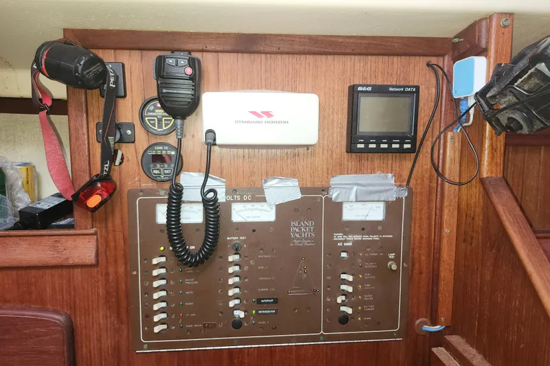 Slide: The Image of Control panel of a 1995 Island Packet 32 yacht with communication devices. - 28