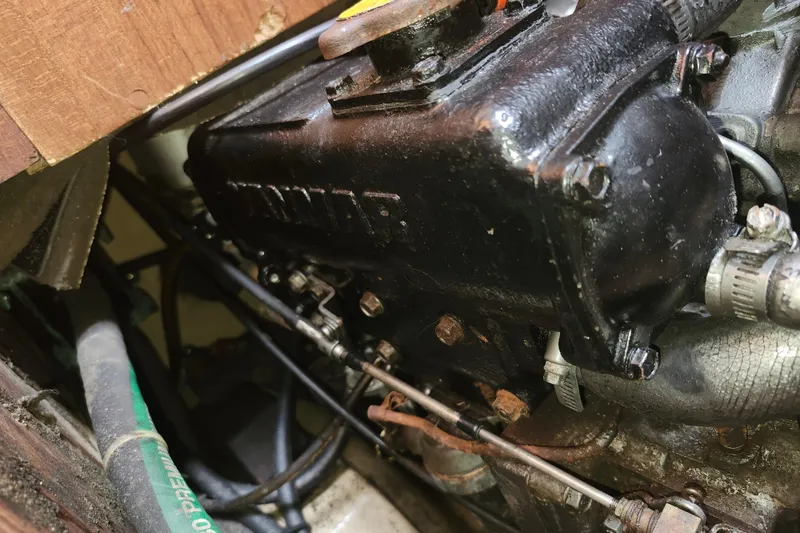 Slide: The Image of Engine compartment of a 1995 Island Packet 32 sailboat, featuring a Yanmar engine. - 41