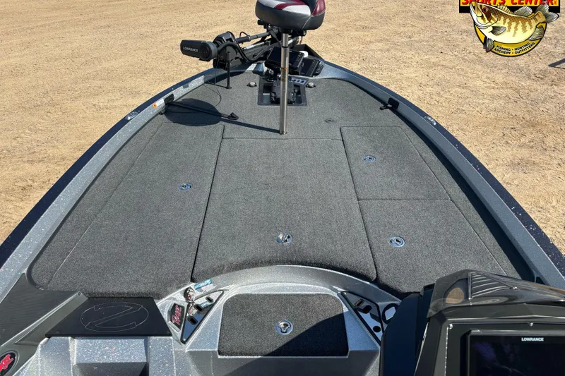 Slide: The Image of 2019 Ranger Z520L boat deck with fishing seat and equipment on sandy ground. - 10