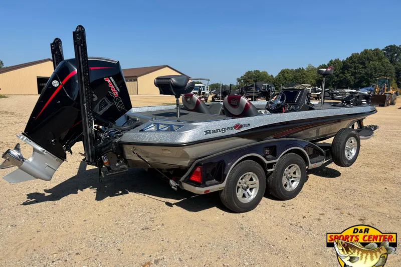Slide: The Image of 2019 Ranger Z520L boat with powerful outboard motor, parked on gravel near buildings. - 4