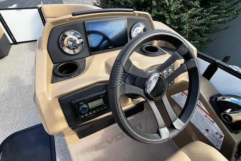 Slide: The Image of Steering console of 2026 Evotti 521CS boat with modern controls and dashboard. - 7