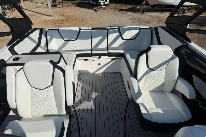 Slide: The Image of 2026 Yamaha Boats 252S interior with luxurious white seating and modern design. - 11