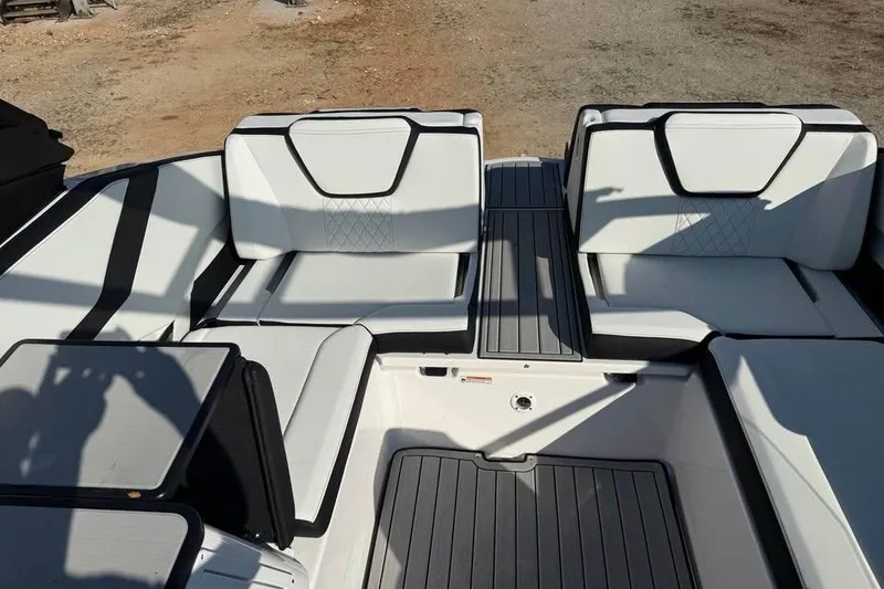 Slide: The Image of 2026 Yamaha Boats 252S interior with sleek white seating and modern design. - 13