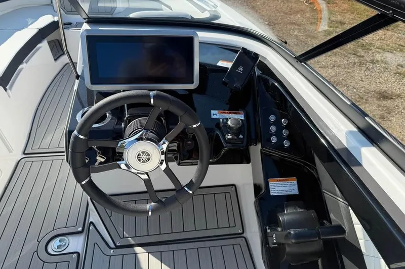 Slide: The Image of 2026 Yamaha Boats 252S dashboard with steering wheel and touchscreen display. - 8