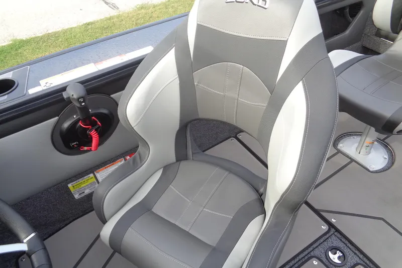 Slide: The Image of 2026 Lund 1875 Crossover XS boat interior with gray and white seating. - 20