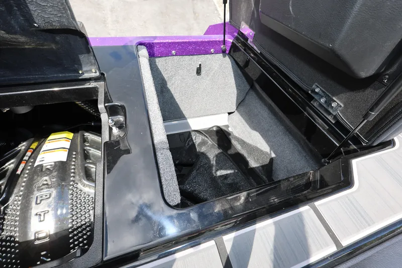 Slide: The Image of 2024 Supra SE550 engine compartment with storage area, featuring sleek design and durable materials. - 25