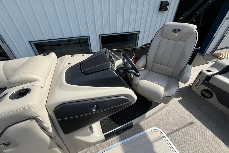 Slide: The Image of 2020 Barletta L23U boat interior with beige captain's chair and console. - 10