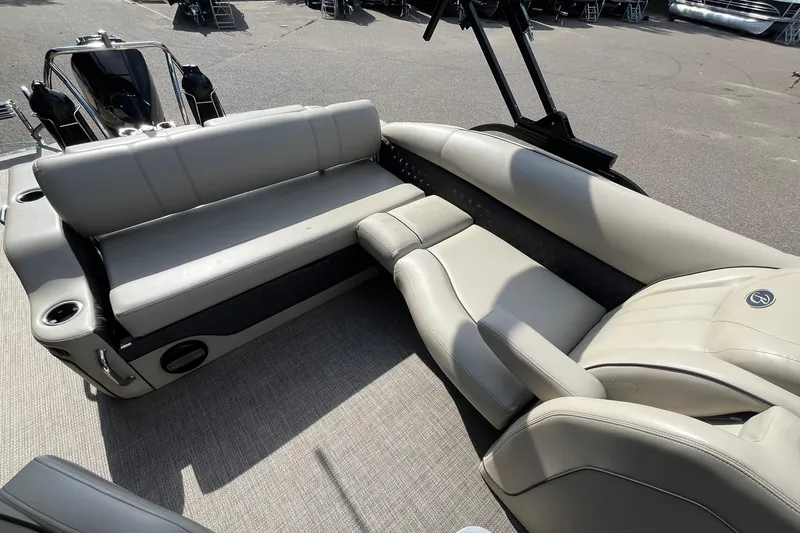 Slide: The Image of 2020 Barletta L23U boat interior with beige seating and cup holders. - 11