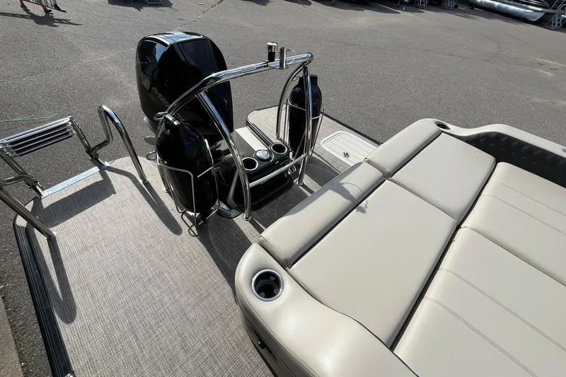 Slide: The Image of 2020 Barletta L23U pontoon boat with outboard motor and spacious seating area. - 14